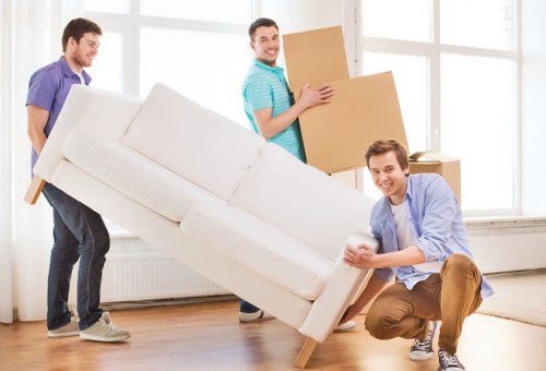 Careful removal of bulky household furniture from a local home