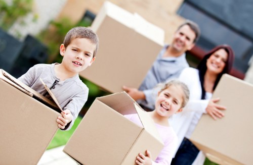 Loading furniture into a van on a residential street in Richmond upon Thames